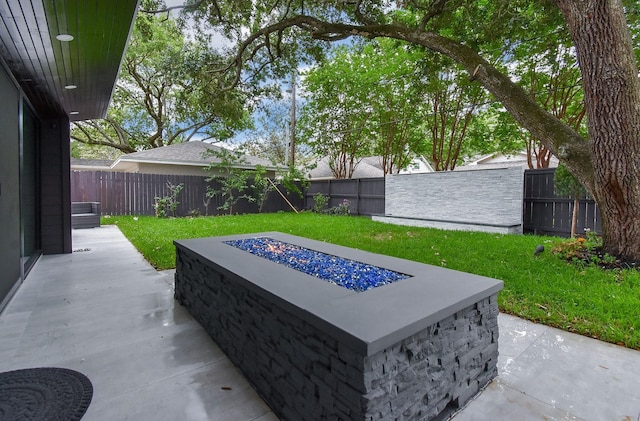 view of patio / terrace with a fire pit