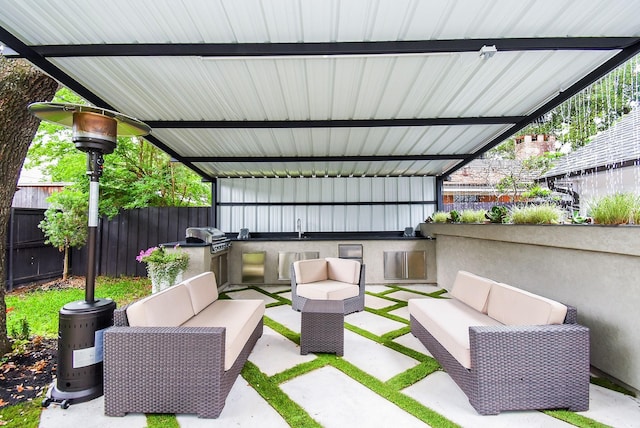 view of patio featuring sink, area for grilling, and an outdoor living space