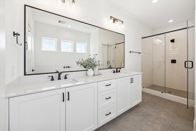 bathroom with vanity and an enclosed shower