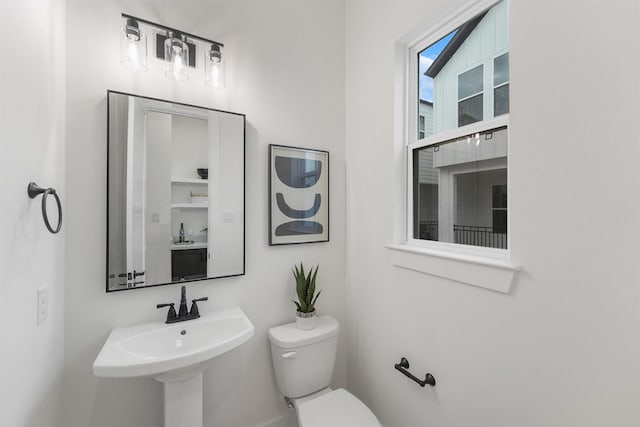 bathroom featuring sink and toilet