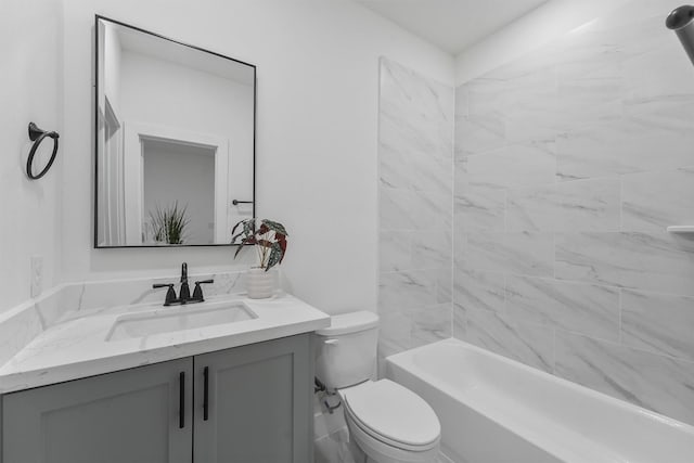 full bathroom with vanity, toilet, and tiled shower / bath combo