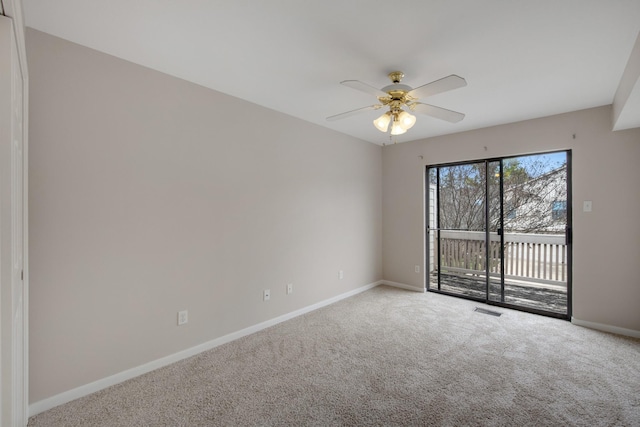 carpeted empty room with ceiling fan