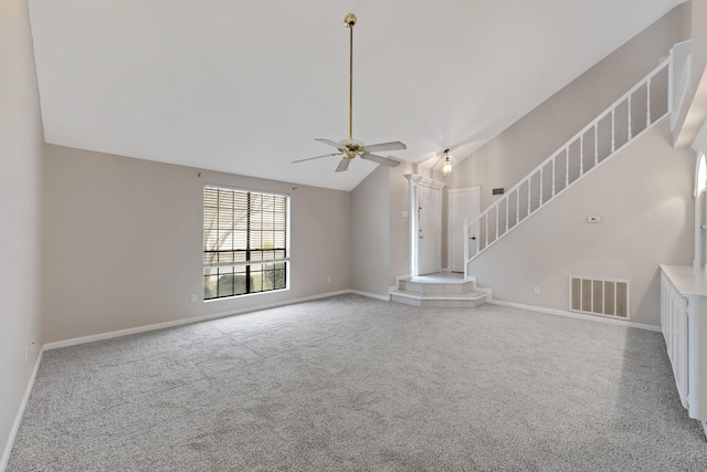 unfurnished living room featuring ceiling fan, carpet floors, and lofted ceiling