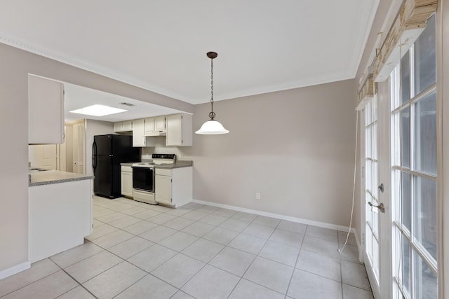 kitchen featuring pendant lighting, white electric range, light tile patterned floors, black refrigerator, and white cabinets