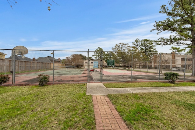 view of sport court with a lawn and tennis court