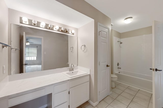 full bathroom with toilet, vanity, ceiling fan, tile patterned floors, and bathing tub / shower combination