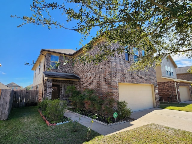 view of front facade featuring a front yard and a garage