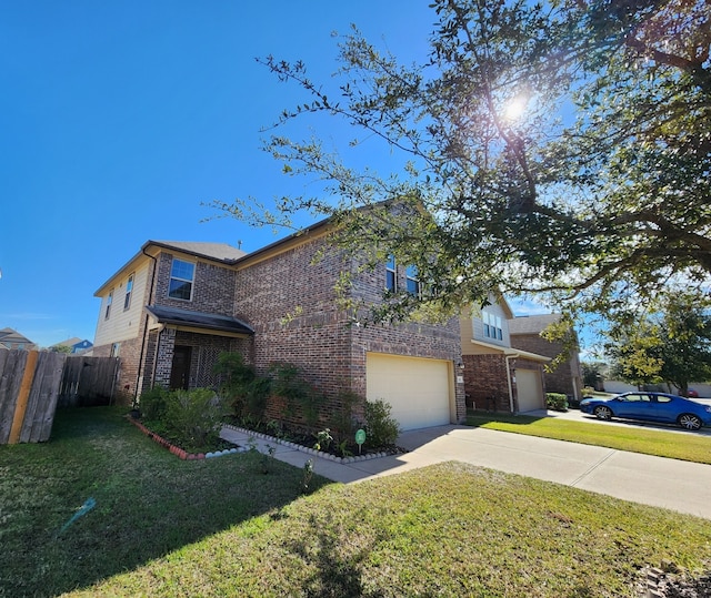 view of front of house with a front lawn and a garage