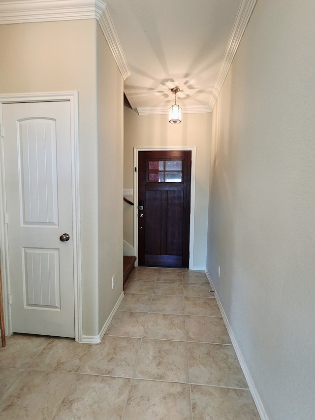 entrance foyer featuring light tile patterned floors and ornamental molding