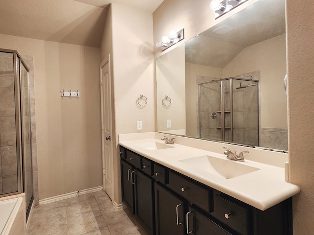 bathroom with lofted ceiling, a shower with door, and vanity