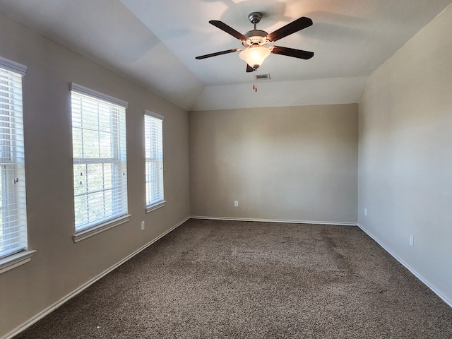 unfurnished room with ceiling fan, carpet flooring, and lofted ceiling