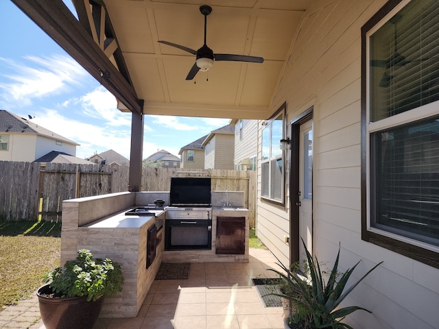 view of patio featuring ceiling fan and area for grilling