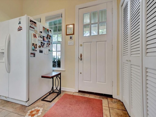 entrance foyer featuring light tile patterned flooring