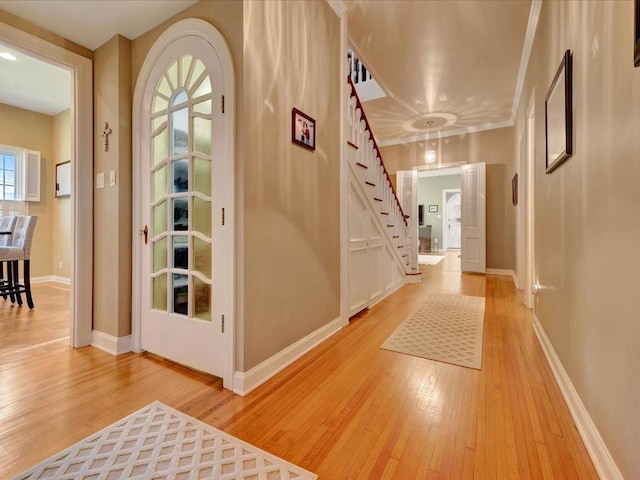 entryway with light hardwood / wood-style floors