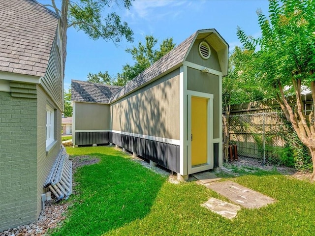 view of outbuilding featuring a yard