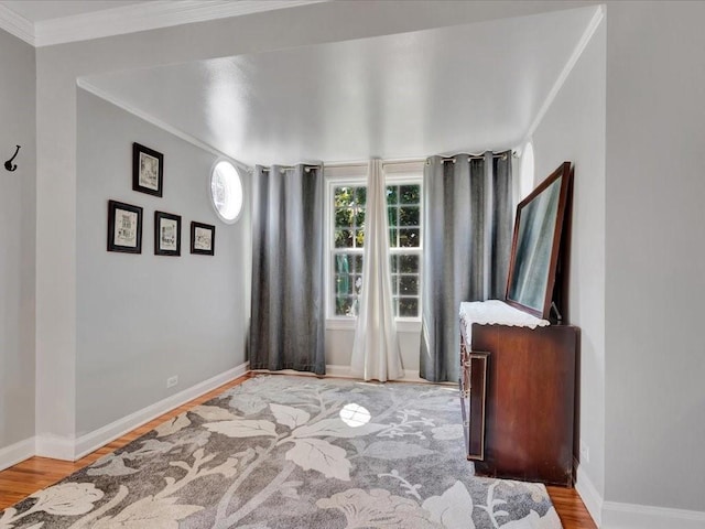 interior space with ornamental molding and light wood-type flooring