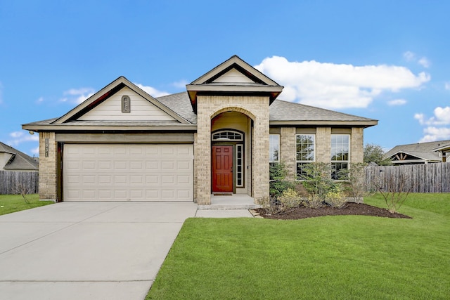 ranch-style house with a garage and a front yard