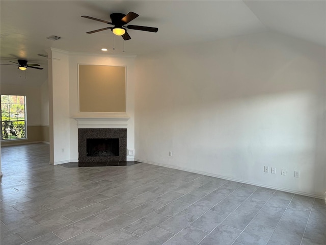 unfurnished living room featuring ceiling fan and vaulted ceiling