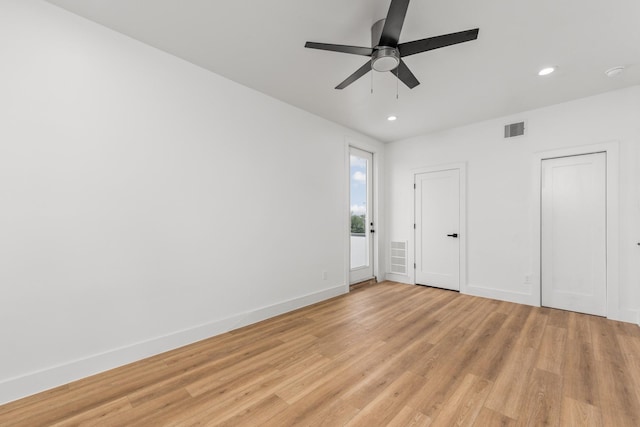 unfurnished bedroom with ceiling fan and light hardwood / wood-style flooring