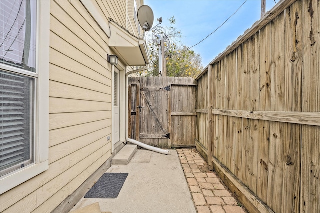 view of side of property with a patio area