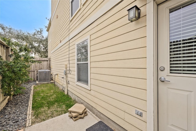 view of property exterior featuring a patio and central AC unit