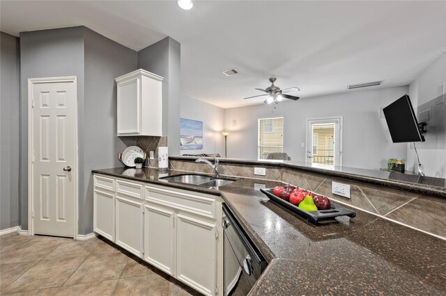 1211 Ennis St, Houston, TX 77003 - kitchen featuring a sink, white cabinets, a ceiling fan, dishwasher, and dark stone counters