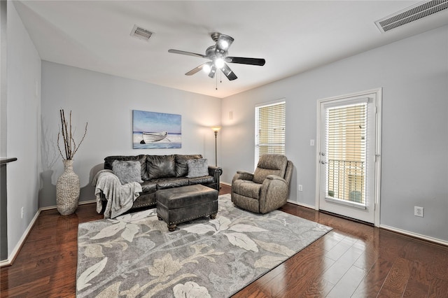 1211 Ennis St, Houston, TX 77003 - living room featuring wood finished floors, ceiling fan, and baseboards