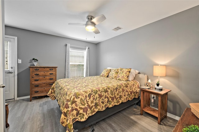 bedroom with wood-type flooring and ceiling fan