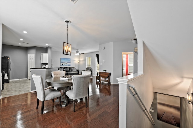 dining room with ceiling fan and dark hardwood / wood-style floors