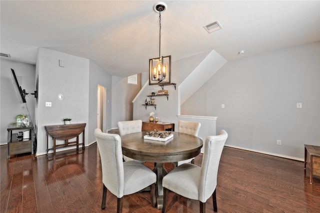 1211 Ennis St, Houston, TX 77003 - dining area featuring a chandelier, wood finished floors, and baseboards