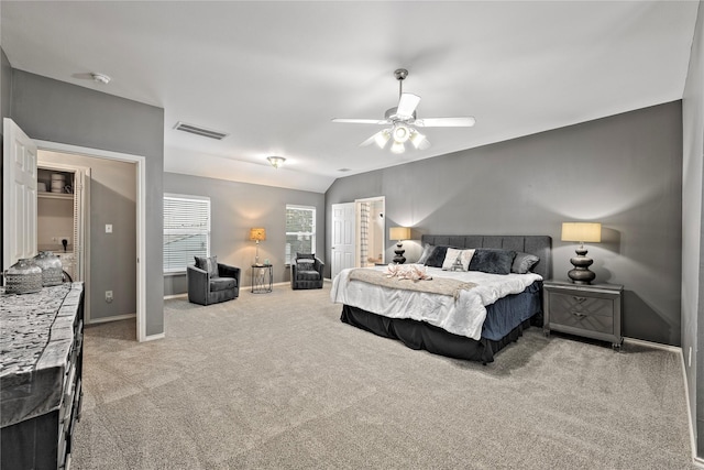 carpeted bedroom featuring lofted ceiling and ceiling fan