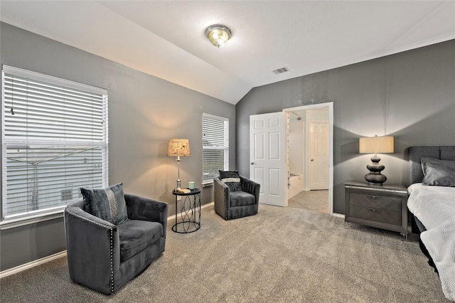 bedroom featuring lofted ceiling and carpet