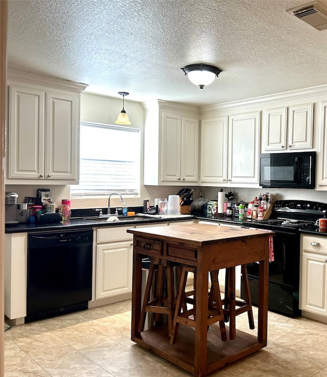 kitchen featuring sink and black appliances