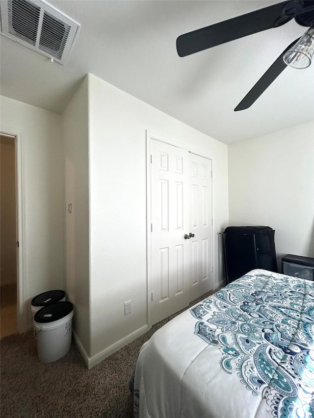 bedroom featuring carpet flooring, a closet, and ceiling fan