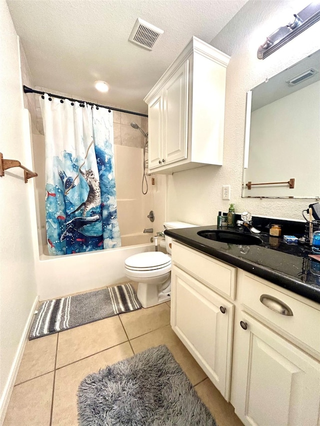 full bathroom with a textured ceiling, tile patterned flooring, toilet, shower / bath combination with curtain, and vanity