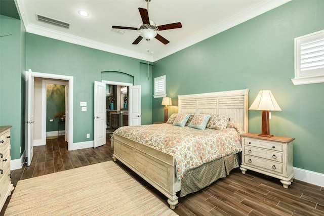 bedroom with ceiling fan, connected bathroom, and crown molding