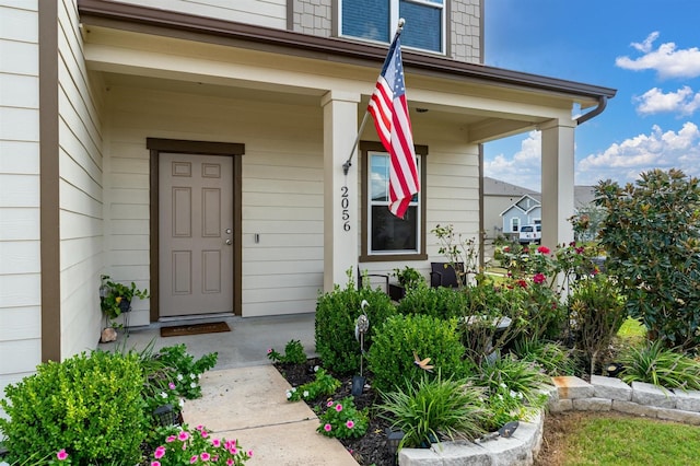 property entrance featuring a porch