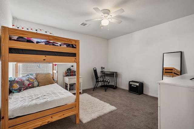 carpeted bedroom with ceiling fan, visible vents, and baseboards