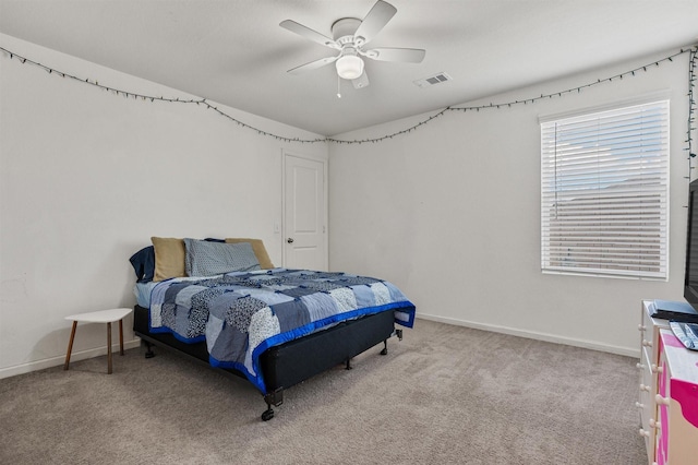 bedroom featuring carpet floors, baseboards, visible vents, and a ceiling fan