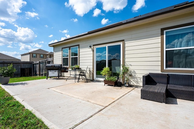 view of patio featuring fence and grilling area