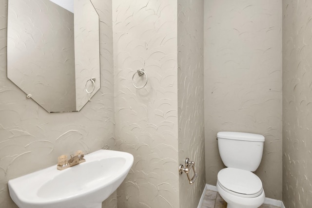 bathroom with sink and toilet