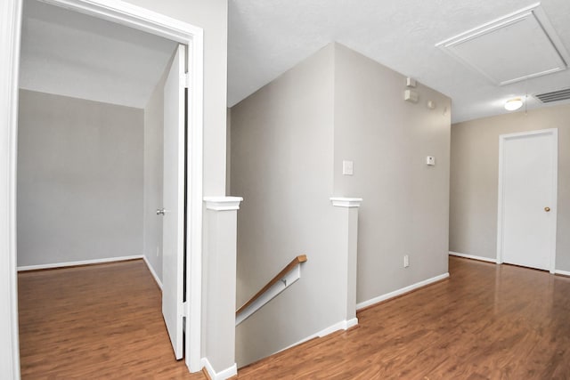 hall with dark hardwood / wood-style flooring