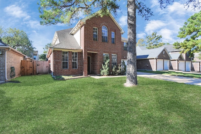 view of front of house with a garage and a front yard