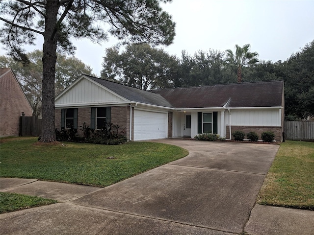 single story home featuring a garage and a front lawn