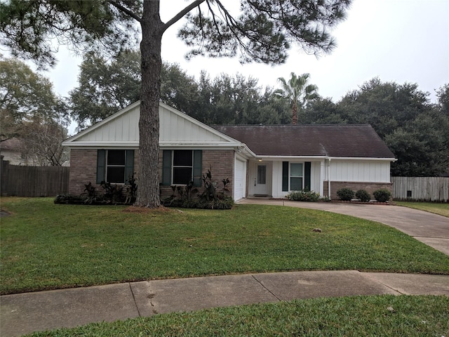 ranch-style home with a garage and a front lawn