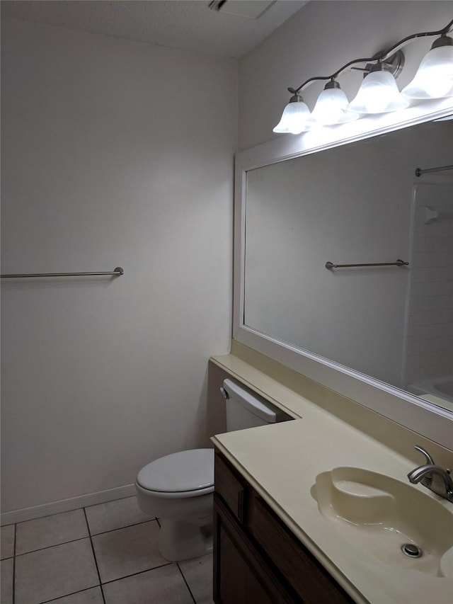 bathroom featuring vanity, toilet, and tile patterned flooring