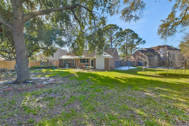 16002 Maple Acres Ct, Houston, TX 77095 - fenced backyard with a trampoline and a patio