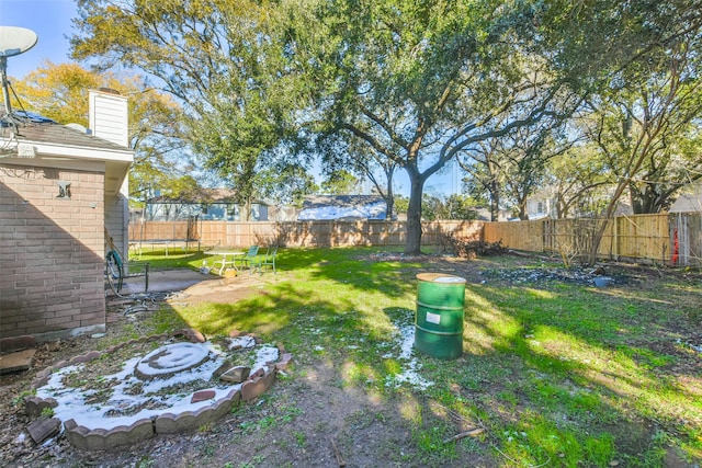 view of yard featuring a trampoline