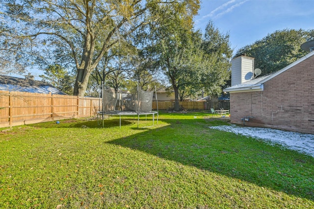 view of yard with a trampoline