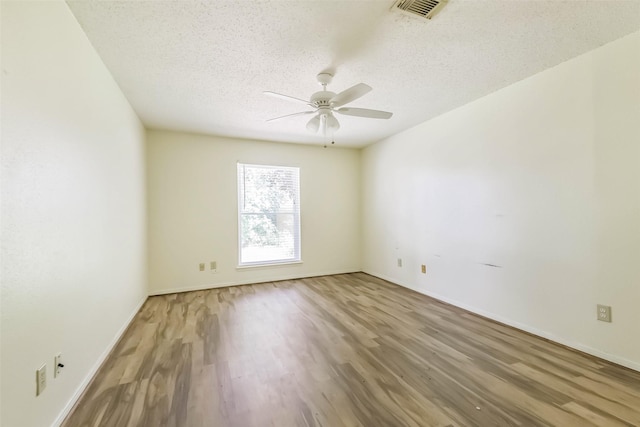 16002 Maple Acres Ct, Houston, TX 77095 - unfurnished room featuring wood finished floors, a ceiling fan, and a textured ceiling